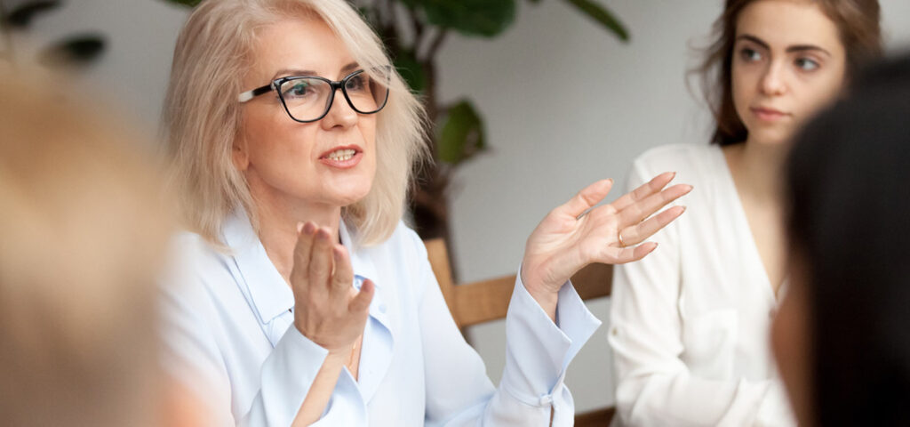 Woman talking during a life coaching course